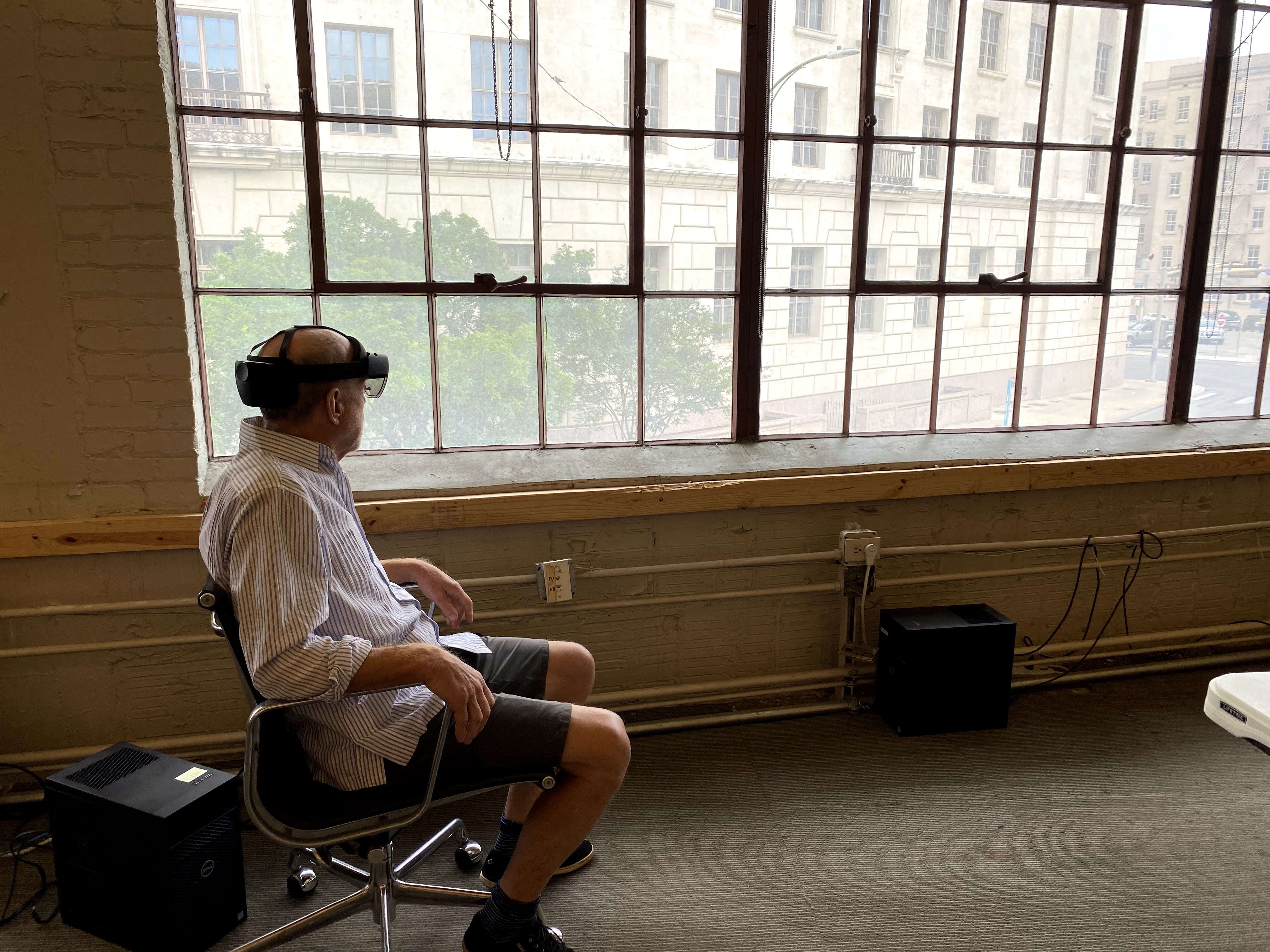 Ted Flato, seated, using Microsoft HoloLens 2